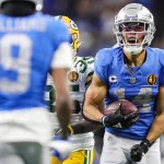 DAZN NFL Programm - NFL heute im Free TV - Der Footballspieler der Detroit Lions, Amon-Ra St. Brown, läuft mit dem Ball in der NFL.