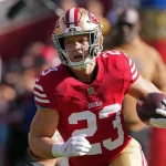 FootballR - Bold Predictions - NFL MVP - Christian McCaffrey, ein Footballspieler der San Francisco 49ers, läuft mit dem Ball.