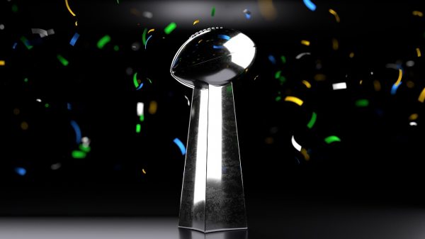FootballR - NFL - Diese Beschreibung wurde automatisch generiert. Die Super Bowl-Trophäe ist von Konfetti umgeben.
Schlüsselwörter: Super Bowl