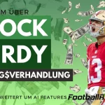 FootballR - NFL - Der Quarterback der San Francisco 49ers, Brock Purdy, scheint vor dem Hintergrund fliegender Gelder konzentriert zu sein und hebt die Vertragsverhandlungen hervor, wie sie im deutschen Text „Vertragsverhandlung“ erwähnt werden Diese Beschreibung wurde automatisch generiert.