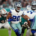 FootballR - NFL - Diese Beschreibung wurde automatisch generiert. Dallas Cowboys vs. Miami Dolphins, mit Tony Pollard.