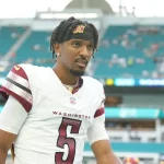 MIAMI GARDENS, FL - AUGUST 17: Washington Commanders quarterback Jayden Daniels 5 leaves the field following pregame warmups before the game between the Washington Commanders and the Miami Dolphins on Saturday, August 17, 2024 at Hard Rock Stadium in Miami Gardens, Fla. Photo by Peter Joneleit/Icon Sportswire NFL, American Football Herren, USA AUG 17 Preseason Commanders at Dolphins EDITORIAL USE ONLY Icon240817017