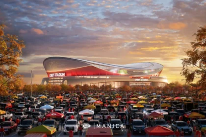 Ein großes Stadion mit roten Akzenten, die Heimstätte der Kansas City Chiefs, ist umgeben von einem überfüllten Parkplatz voller Autos und Tailgating-Zelten unter einem teilweise bewölkten Abendhimmel. Alt-Text wurde KI-generiert.