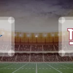 Football-Stadion-Hintergrund mit dem Stern-Logo der Dallas Cowboys auf der linken Seite und dem "NY"-Logo der New York Giants auf der rechten Seite, getrennt durch das "vs" in der Mitte - perfekt für die Werbung für das Spiel Dallas Cowboys gegen New York Giants am 27.09.2024. Alt-Text wurde KI-generiert.