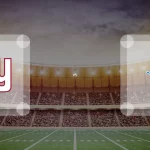 Ein Football-Stadion-Hintergrund mit dem Logo der New York Giants auf der linken Seite, dem Logo der Detroit Lions auf der rechten Seite und "vs" in der Mitte - perfekt, um die Spannung eines Spiels im Jahr 2025 darzustellen. Alt-Text wurde KI-generiert.