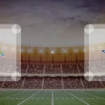 Ein Football-Stadion-Hintergrund mit dem Logo der Los Angeles Chargers auf der linken Seite und dem Logo der Dallas Cowboys auf der rechten Seite, getrennt durch "vs" in der Mitte, weist auf das Spiel am 21.12.2025 hin. Alt-Text wurde KI-generiert.