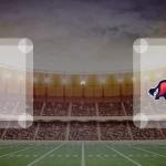 Eine Gamecard Grafik fuer das Spiel zwischen den Pforzheim Wilddogs und ifm Razorbacks Ravensburg am 30.05.26. die zwei Teamlogos stehen sich in einem Stadion mit vielen Zuschauern gegenueber.