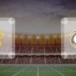 Eine Gamecard Grafik fuer das Spiel zwischen den Hildesheim Invaders und Kiel Baltic Hurricanes am 07.06.26. die zwei Teamlogos stehen sich in einem Stadion mit vielen Zuschauern gegenueber.