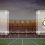 Eine Gamecard Grafik fuer das Spiel zwischen den Schwäbisch Hall Unicorns und Kiel Baltic Hurricanes am 08.08.26. die zwei Teamlogos stehen sich in einem Stadion mit vielen Zuschauern gegenueber.