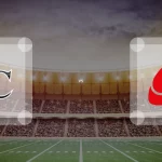 Eine Gamecard Grafik fuer das Spiel zwischen den Allgäu Comets und Saarland Hurricanes am 29.08.26. die zwei Teamlogos stehen sich in einem Stadion mit vielen Zuschauern gegenueber.