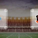 Eine Gamecard Grafik fuer das Spiel zwischen den Detroit Lions und Cincinnati Bengals am 14.08.26. die zwei Teamlogos stehen sich in einem Stadion mit vielen Zuschauern gegenueber.