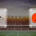 Eine Gamecard Grafik fuer das Spiel zwischen den Baltimore Ravens und Cleveland Browns am 18.10.26. die zwei Teamlogos stehen sich in einem Stadion mit vielen Zuschauern gegenueber.