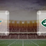 Eine Gamecard Grafik fuer das Spiel zwischen den Miami Dolphins und New York Jets am 25.10.26. die zwei Teamlogos stehen sich in einem Stadion mit vielen Zuschauern gegenueber.
