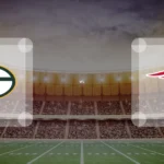 Eine Gamecard Grafik fuer das Spiel zwischen den Green Bay Packers und New England Patriots am 08.11.26. die zwei Teamlogos stehen sich in einem Stadion mit vielen Zuschauern gegenueber.