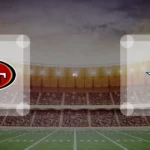 Eine Gamecard Grafik fuer das Spiel zwischen den San Francisco 49ers und Dallas Cowboys am 15.11.26. die zwei Teamlogos stehen sich in einem Stadion mit vielen Zuschauern gegenueber.