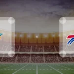 Eine Gamecard Grafik fuer das Spiel zwischen den Miami Dolphins und Buffalo Bills am 22.11.26. die zwei Teamlogos stehen sich in einem Stadion mit vielen Zuschauern gegenueber.