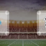 Eine Gamecard Grafik fuer das Spiel zwischen den Detroit Lions und Atlanta Falcons am 06.12.26. die zwei Teamlogos stehen sich in einem Stadion mit vielen Zuschauern gegenueber.