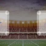 Eine Gamecard Grafik fuer das Spiel zwischen den Dallas Cowboys und Los Angeles Rams am 20.12.26. die zwei Teamlogos stehen sich in einem Stadion mit vielen Zuschauern gegenueber.
