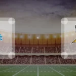 Eine Gamecard Grafik fuer das Spiel zwischen den Detroit Lions und Minnesota Vikings am 21.12.26. die zwei Teamlogos stehen sich in einem Stadion mit vielen Zuschauern gegenueber.