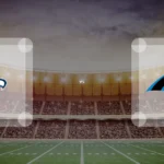 Eine Gamecard Grafik fuer das Spiel zwischen den Seattle Seahawks und Carolina Panthers am 03.01.27. die zwei Teamlogos stehen sich in einem Stadion mit vielen Zuschauern gegenueber.